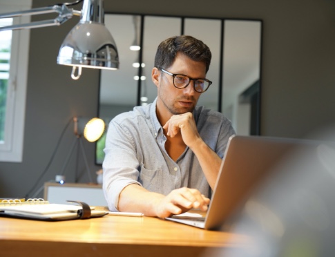 A man with a computer working