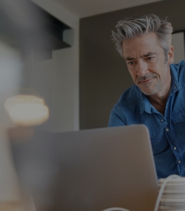 a working guy in front of computer